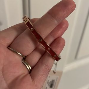 Kate Spade bangle. Color is magenta pink. New w/ tag. Never worn.